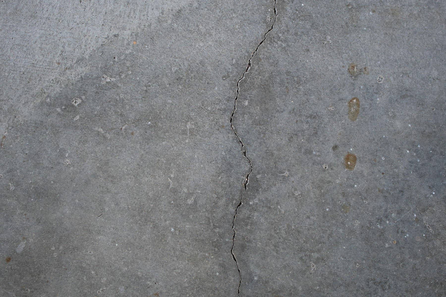 Close-up of a long crack running through a worn concrete slab, Lake Lanier area